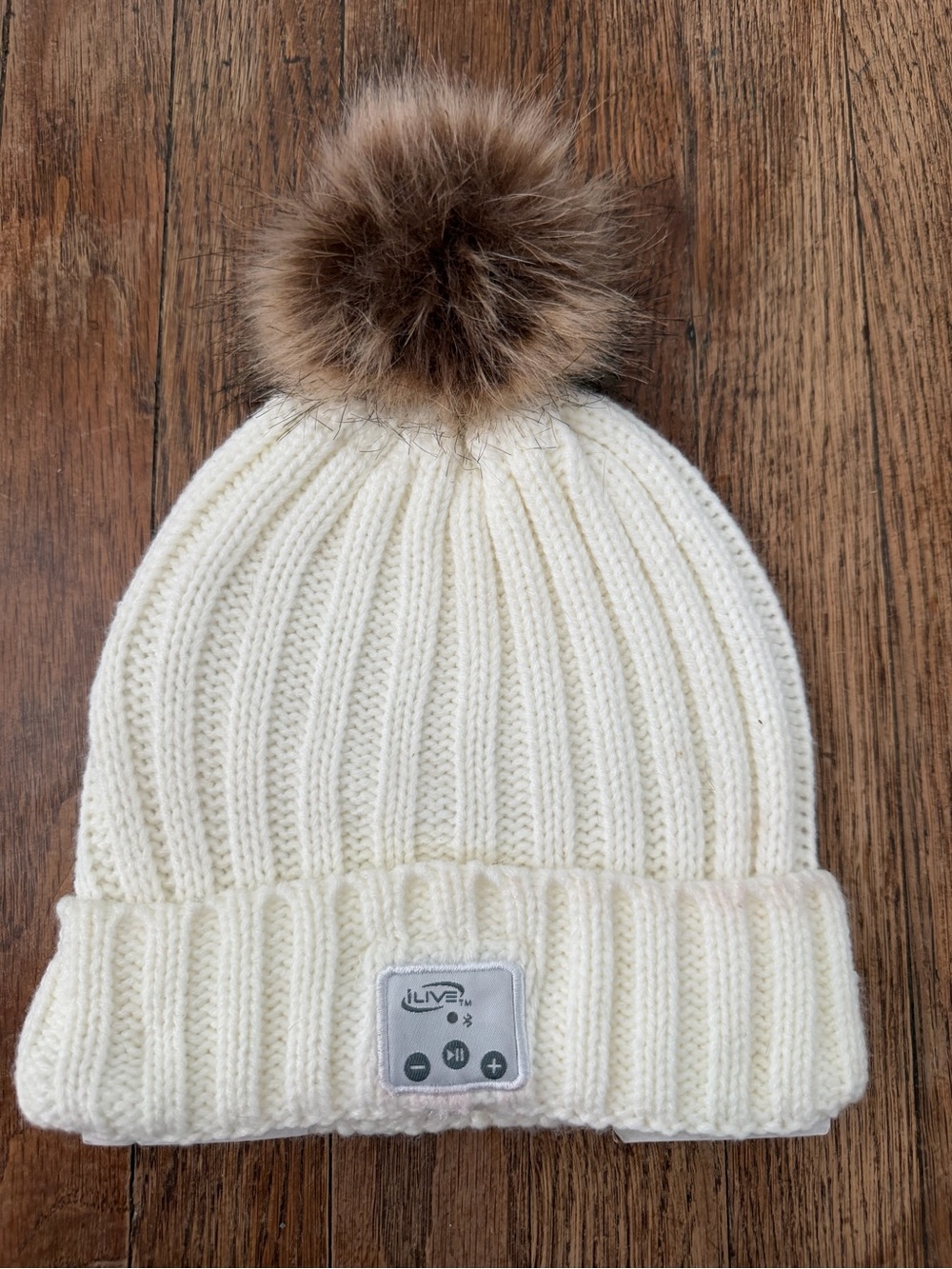 Cream Knit Pom Beanie with Built-In Bluetooth Controls